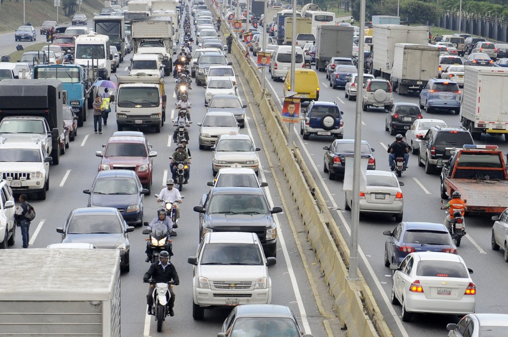 Traffic in Caracas, where inexpensive fuel keeps old gas guzzlers on the road.Credit...Leo Ramirez/Agence France-Presse — Getty Images